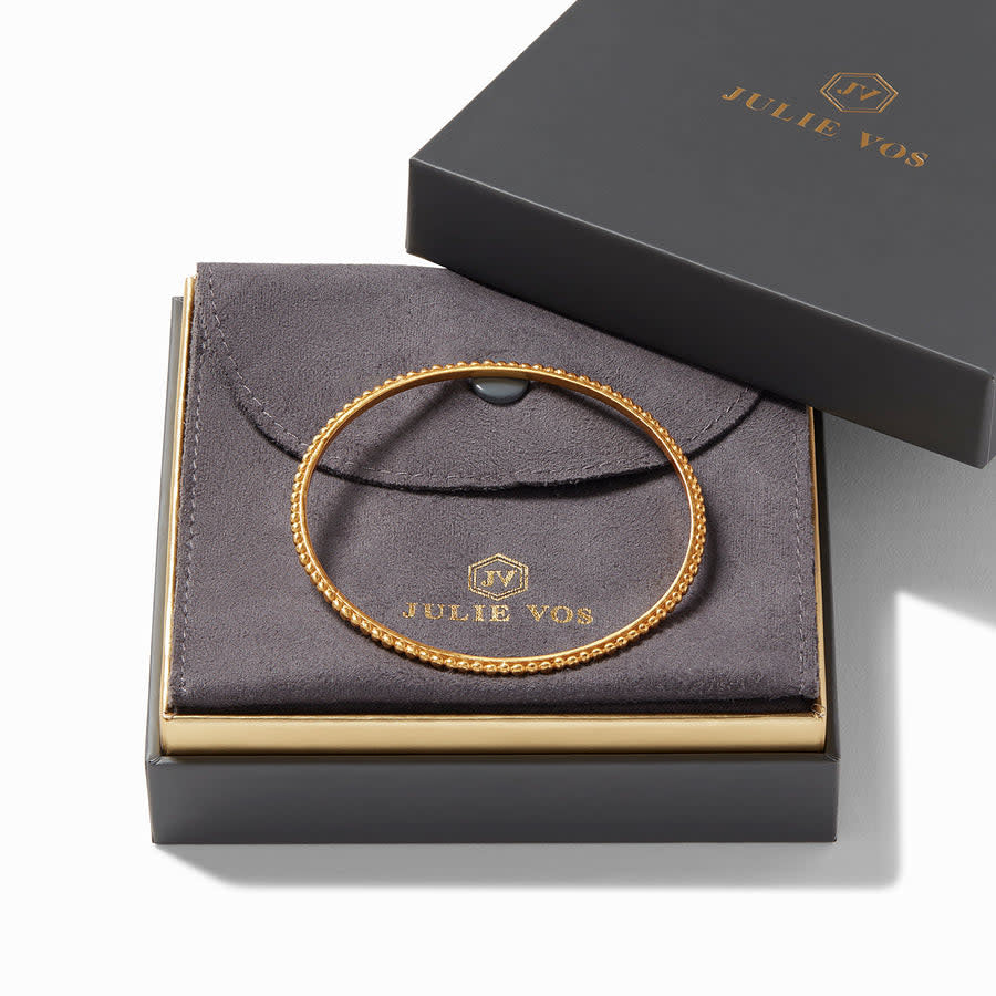 Slender gold-plated bangle with raised bead detail and Julie Vos hallmark.