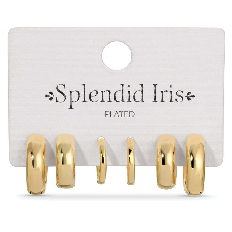 Set of three simple huggie earrings in assorted gold tones with rhodium plating.