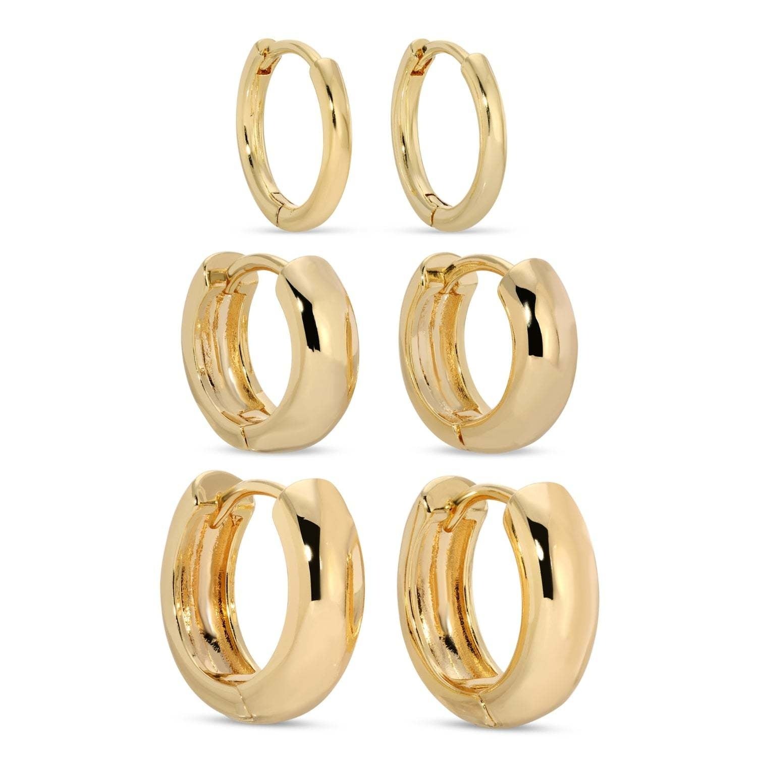 Set of three simple assorted huggie earrings in gold-tone finish.