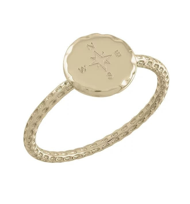 Gold layered ring with a bold yet elegant compass-inspired silhouette.