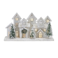 17-inch LED lighted wooden Christmas village scene with snowy houses and frosted pine trees.