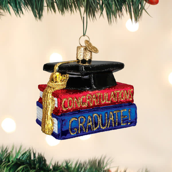 Handcrafted glass ornament shaped like a graduation cap with 'Congrats Graduate' text.