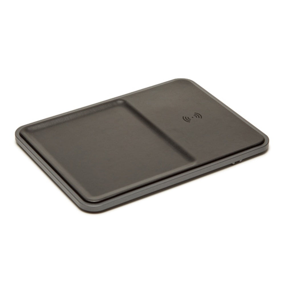 Conor wireless charging tray in sleek vegan leather with a valet silhouette holding an iPhone.