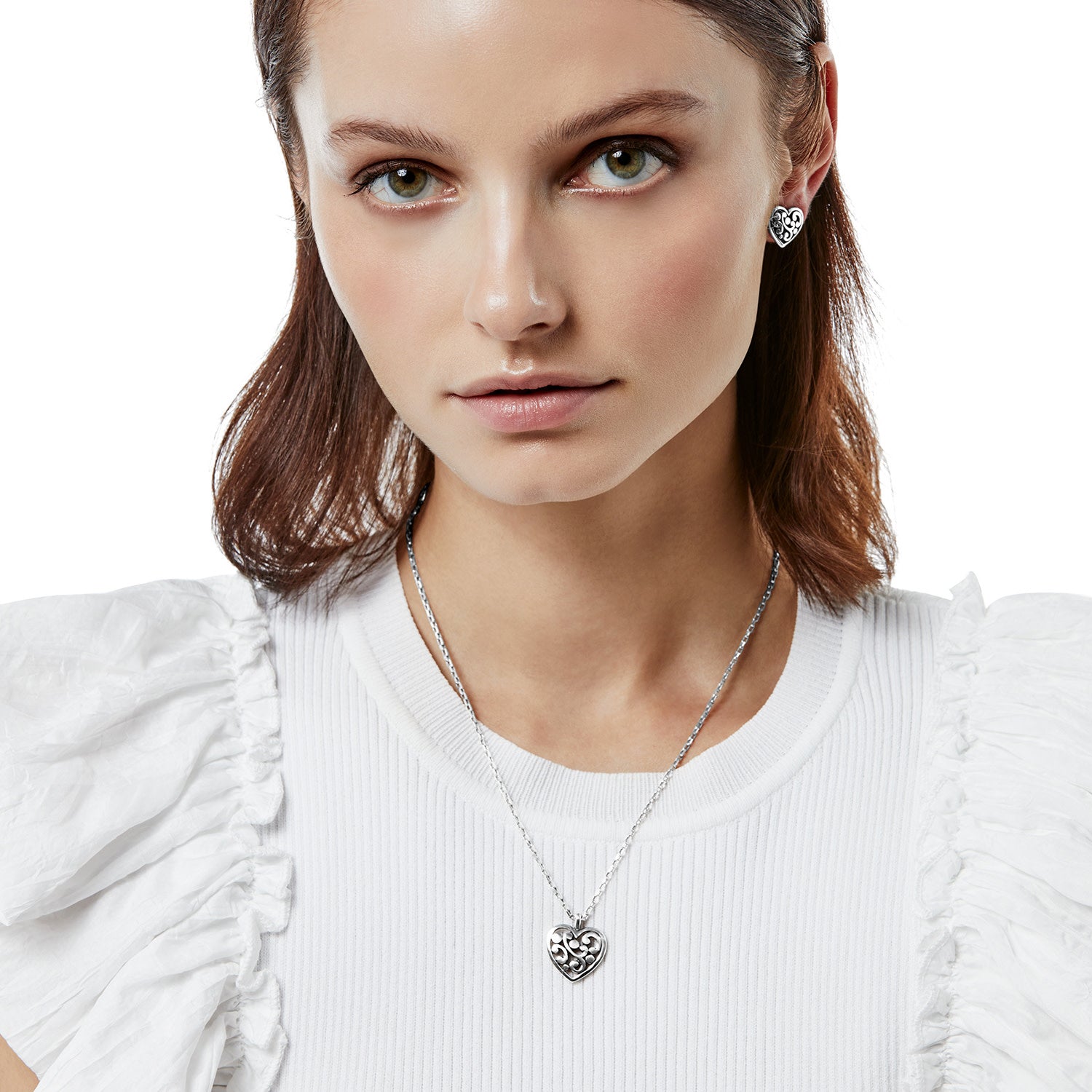 Gold plated heart pendant necklace with lobster claw closure on adjustable chain