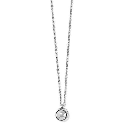 Silver plated spherical pendant necklace with pierced scrolled details on a silver chain.