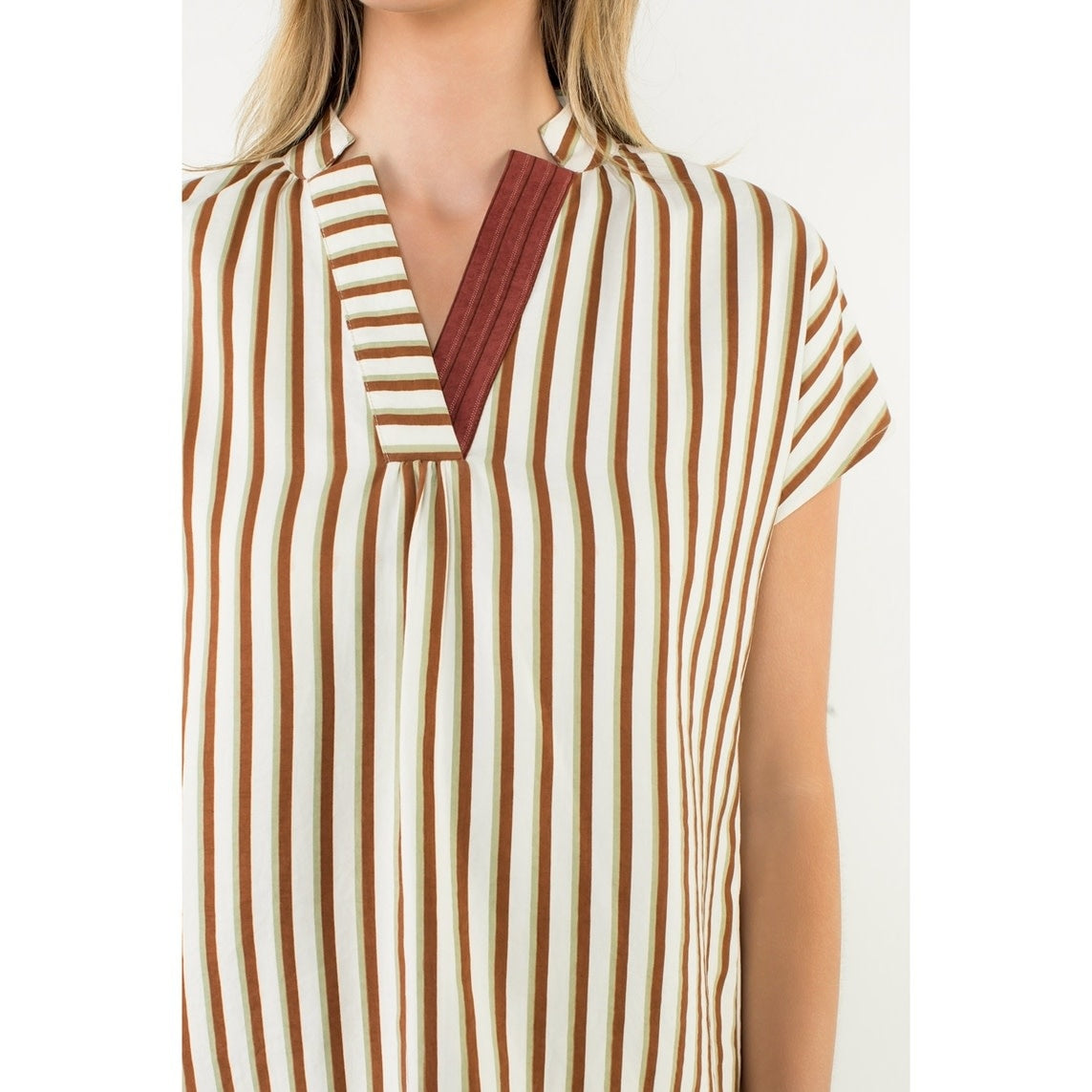 Cassie Contrast V-Neck striped woven top in polyester and nylon with a flattering silhouette.