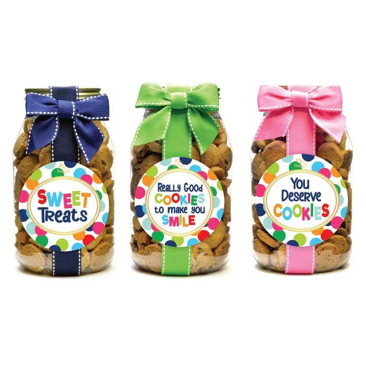 Quart jar filled with chocolate chip cookies featuring a colorful polka dot label pattern.