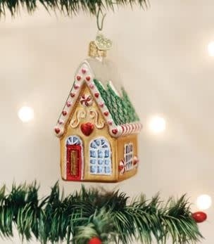Cookie Cottage Ornament featuring gingerbread house shape with candy decorations in warm brown tones.