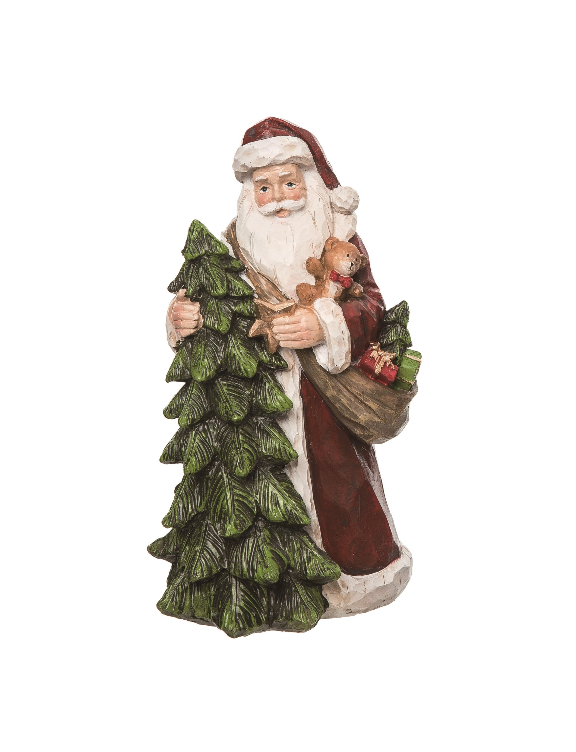 Carved resin Santa figurine holding a Christmas tree, teddy bear, and sack of gifts.