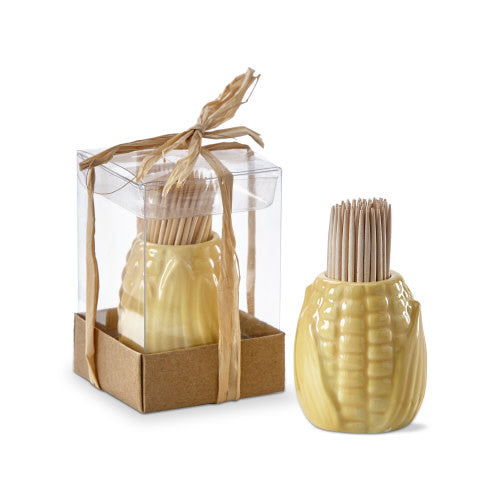 Earthenware corn-shaped toothpick holder with hand-painted green leaves on a yellow body.