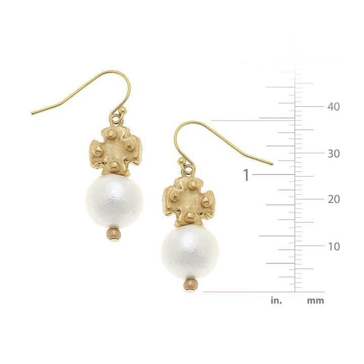 Cotton pearl drop earrings featuring mini gold cross accents with a Northern European-inspired silhouette.