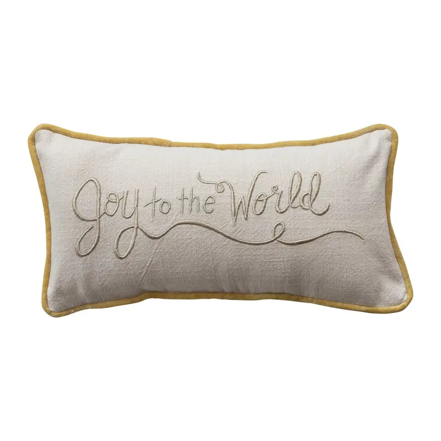 Cotton slub lumbar pillow with festive 'Joy to the World' text in red on a neutral background.
