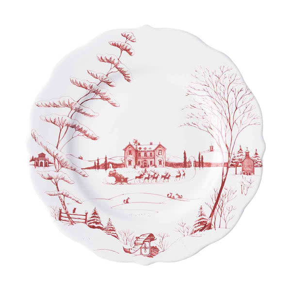 Ceramic dinner plate with scalloped edge featuring a festive ruby winter scene.