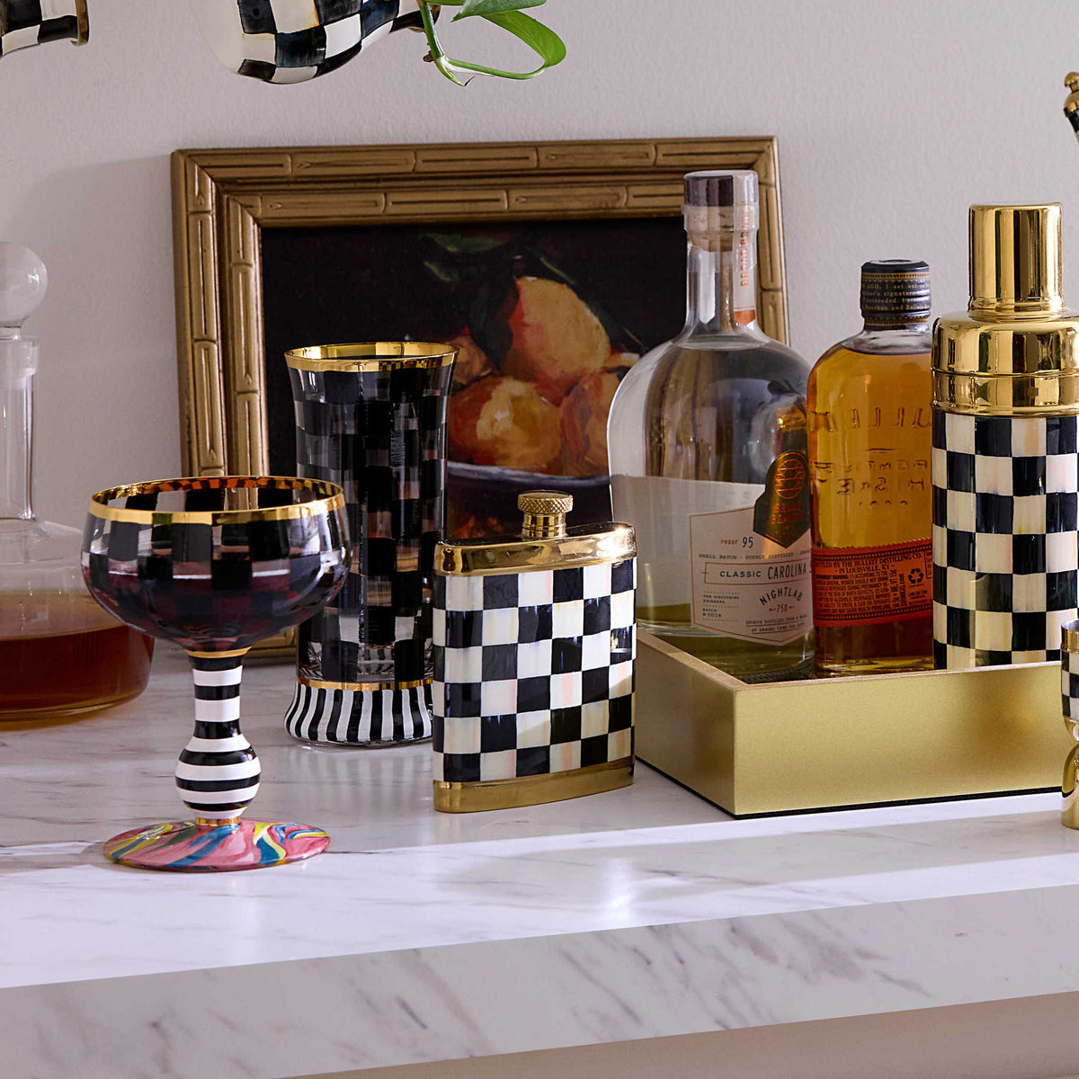 Gold-toned stainless steel flask with Courtly Check enamel pattern, funnel included.