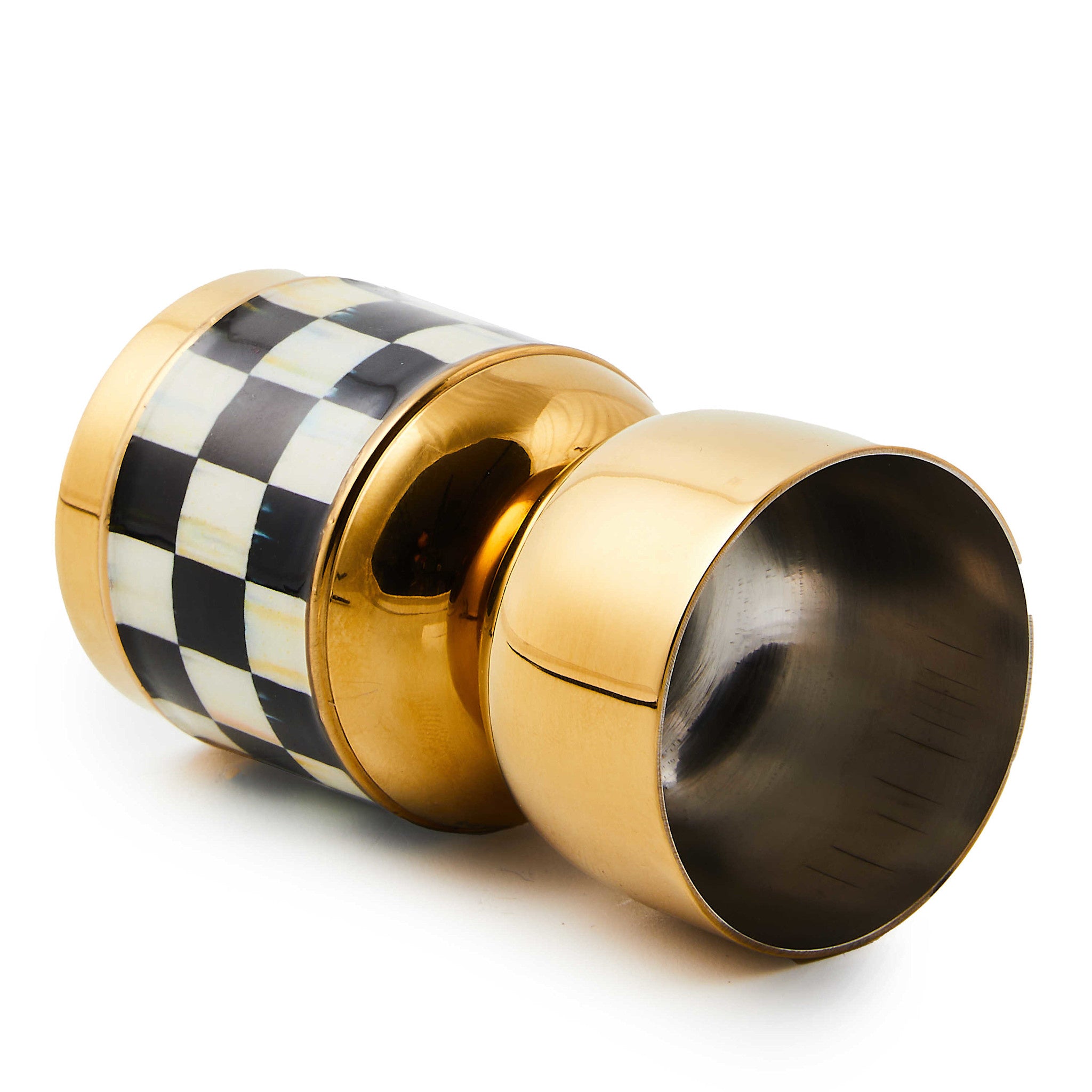 Double-sided stainless steel jigger with gold enamel coating in Courtly Check pattern.