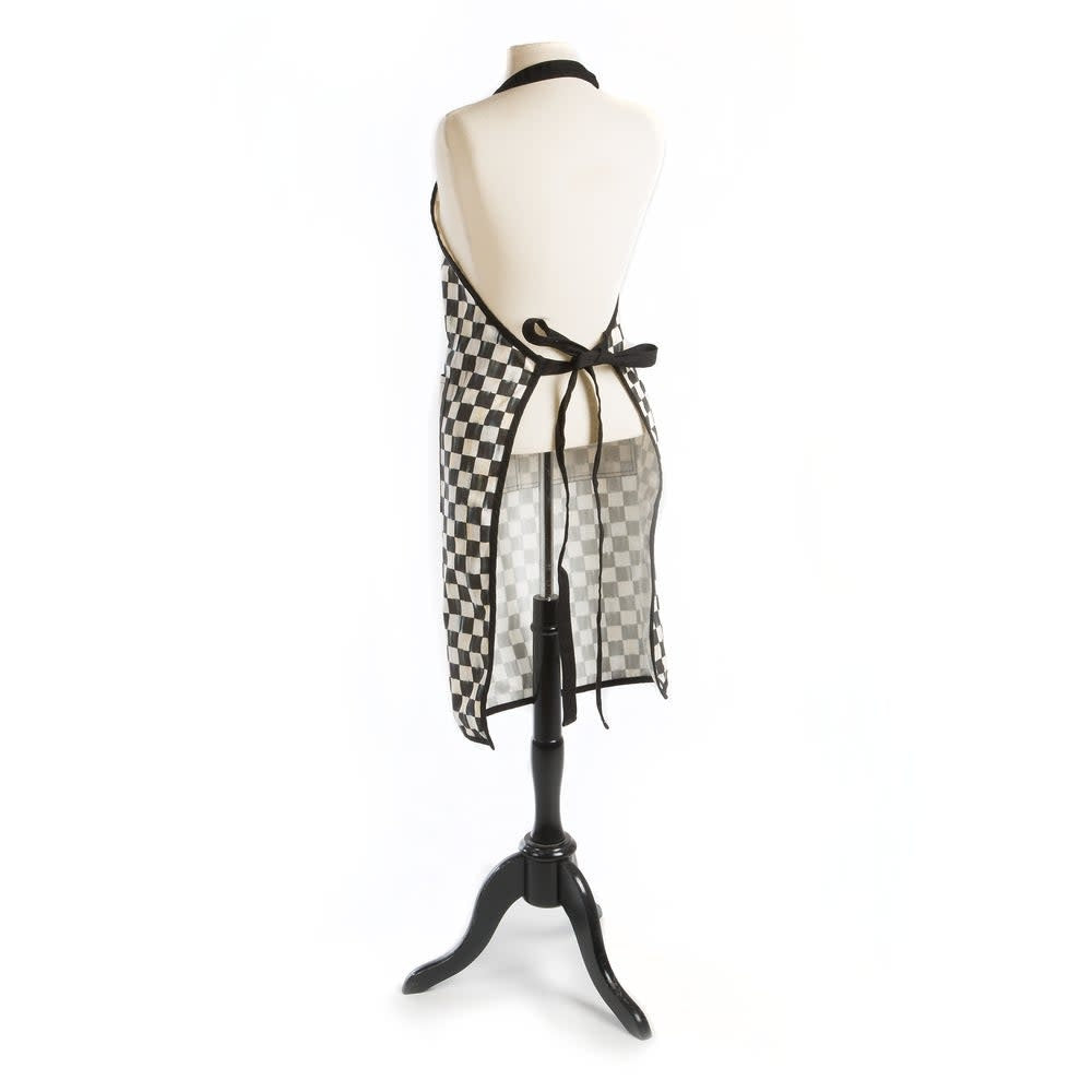 Courtly Check bistro apron in navy blue cotton with leather trim and brass grommets.