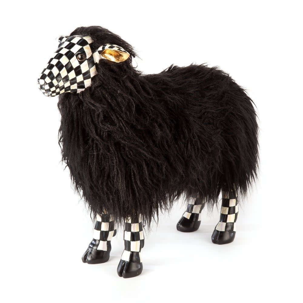 Small black resin sheep figurine with a white checkered coat pattern.