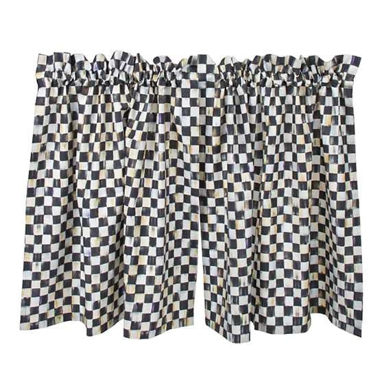 Two Courtly Check cafe curtains in cotton fabric with a gingham pattern, rod pockets, and ruffled hems.