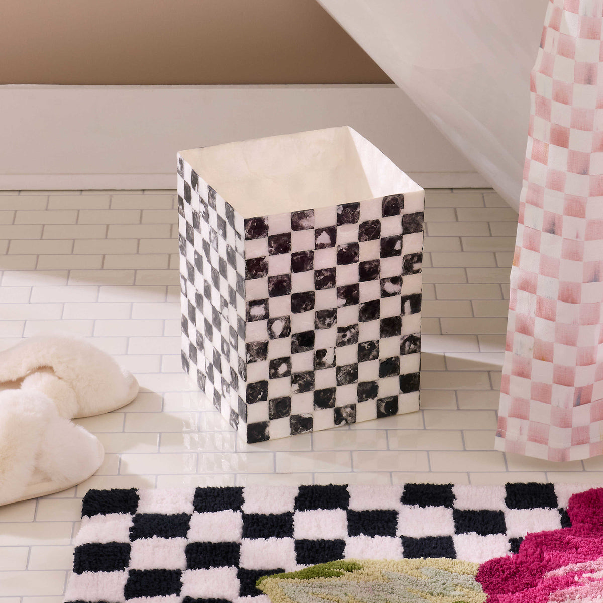 Courtly Check Capiz waste bin with a natural shell material featuring a checkered pattern and rounded silhouette.