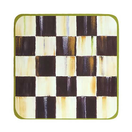 Set of four cork-backed coasters with a black-and-white checked pattern on heat-resistant lacquered hard board.