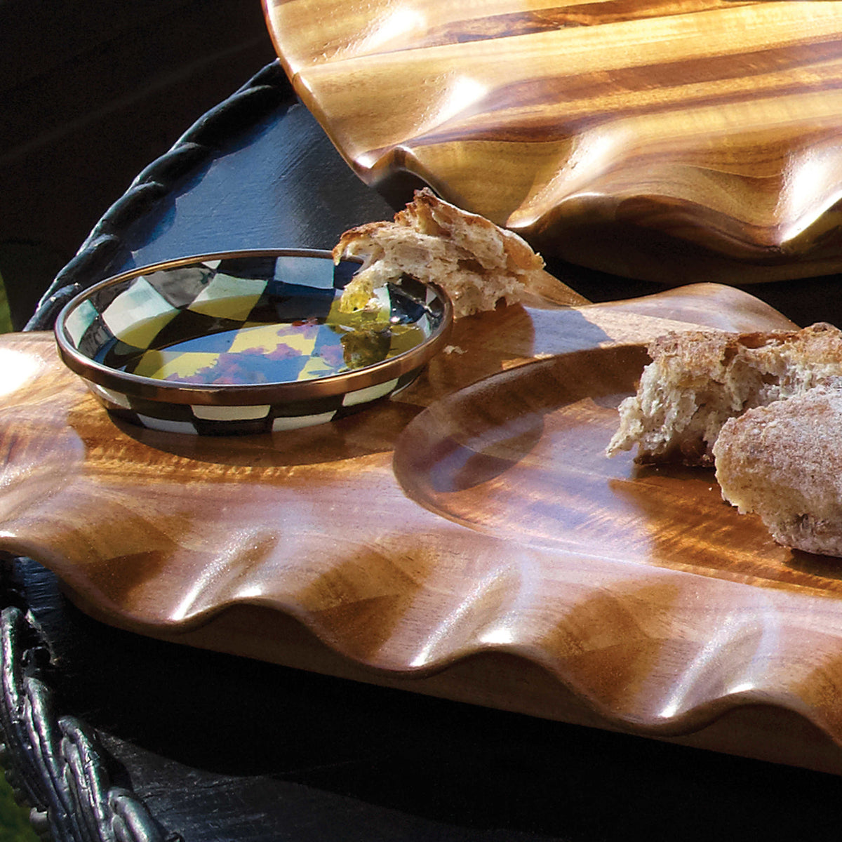 Hand-glazed steel dipping bowl with Courtly Checks pattern and bronzed stainless rim