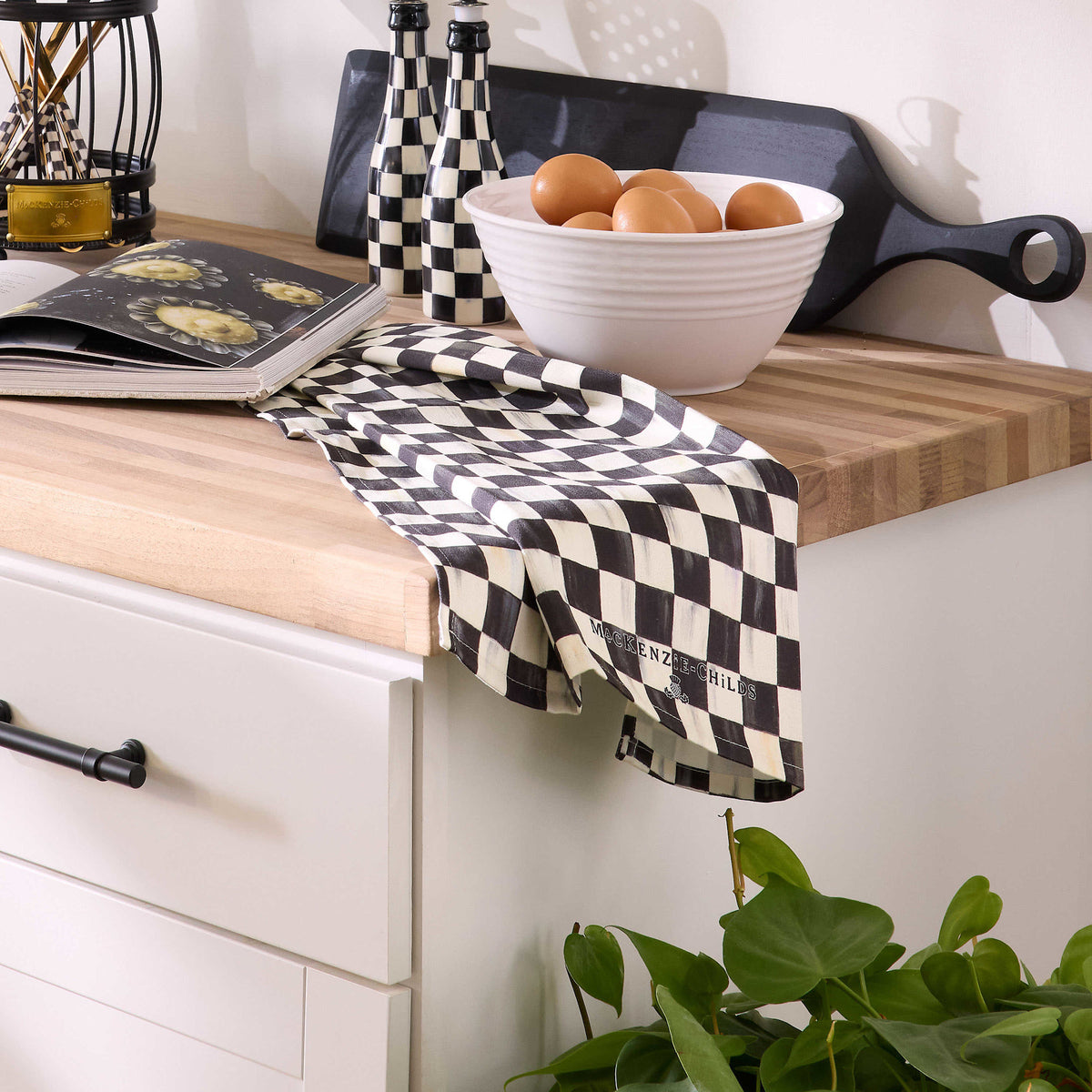 Courtly Check dish towel made of cotton with a signature check pattern and distinctive logo.
