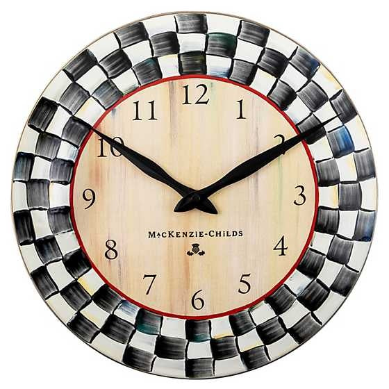 Round Courtly Check enamel clock with hand-painted checkered pattern on steel face and bronzed stainless rim.