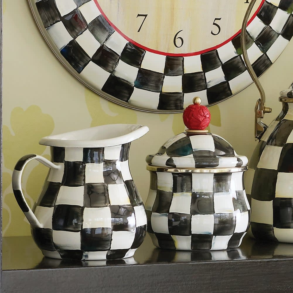 Hand-painted Courtly Check enamel creamer with a steel body in blue and white check pattern.