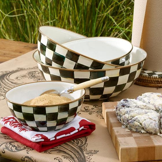 Small Courtly Check enamel bowl with hand-painted blue check pattern on steel body and bronzed stainless rim.