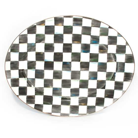 Large oval enamel platter with hand-painted Courtly Check pattern in accent colors and a bronzed stainless steel rim.