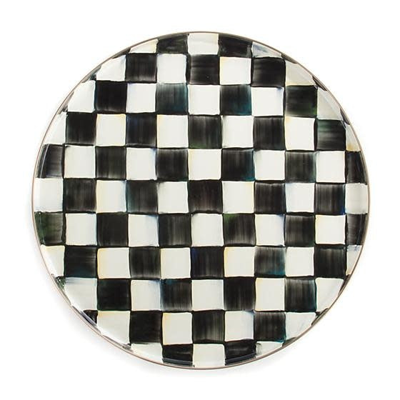 Round Courtly Check enamel tray with hand-glazed steel surface, bronzed rim, and checkered pattern.