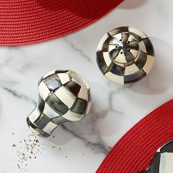 Black-and-white Courtly Check enamel salt and pepper shakers with silicone plugs.