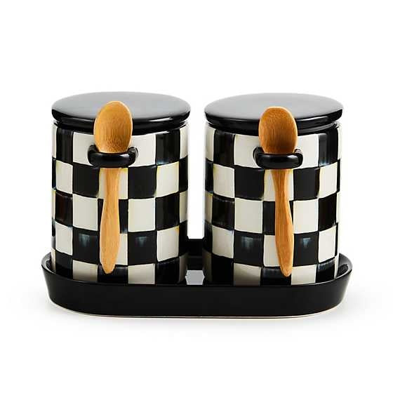 Set of two ceramic Courtly Check farmhouse canisters on a tray with attached wooden spoons.