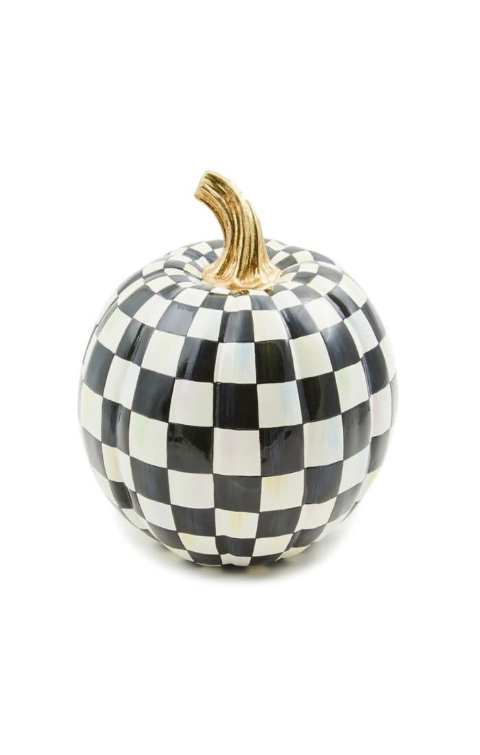 Glossy black-and-white check resin pumpkin with a small silhouette.