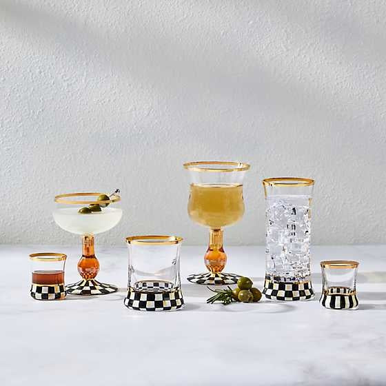 Hand-painted Courtly Check tumbler glass with gold lustre trim on a blue base.