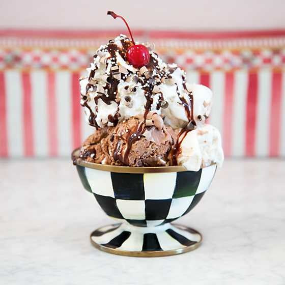 Hand-glazed black steel ice cream dish with Courtly Check pattern and bronzed rim