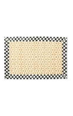 Natural jute rug with a honeycomb checkered pattern in earthy tones.