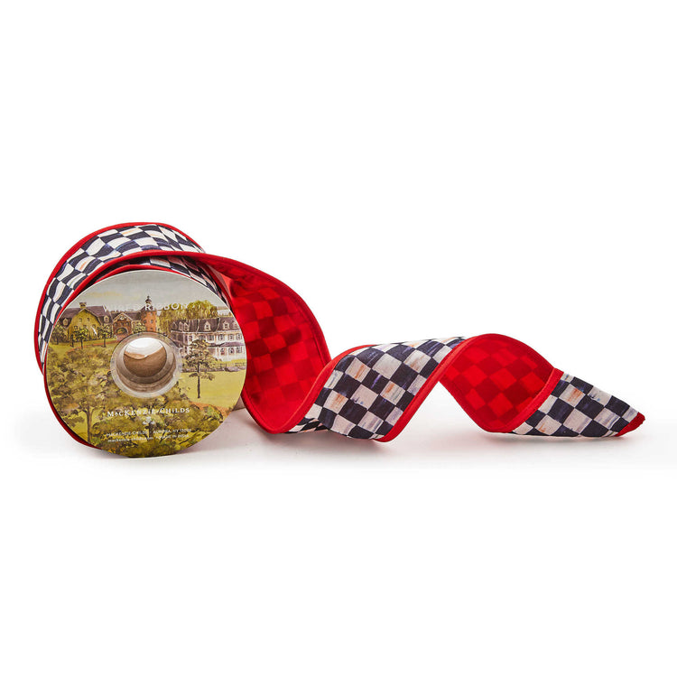 Spool of wired Courtly Check red polyester ribbon with a checkered pattern.