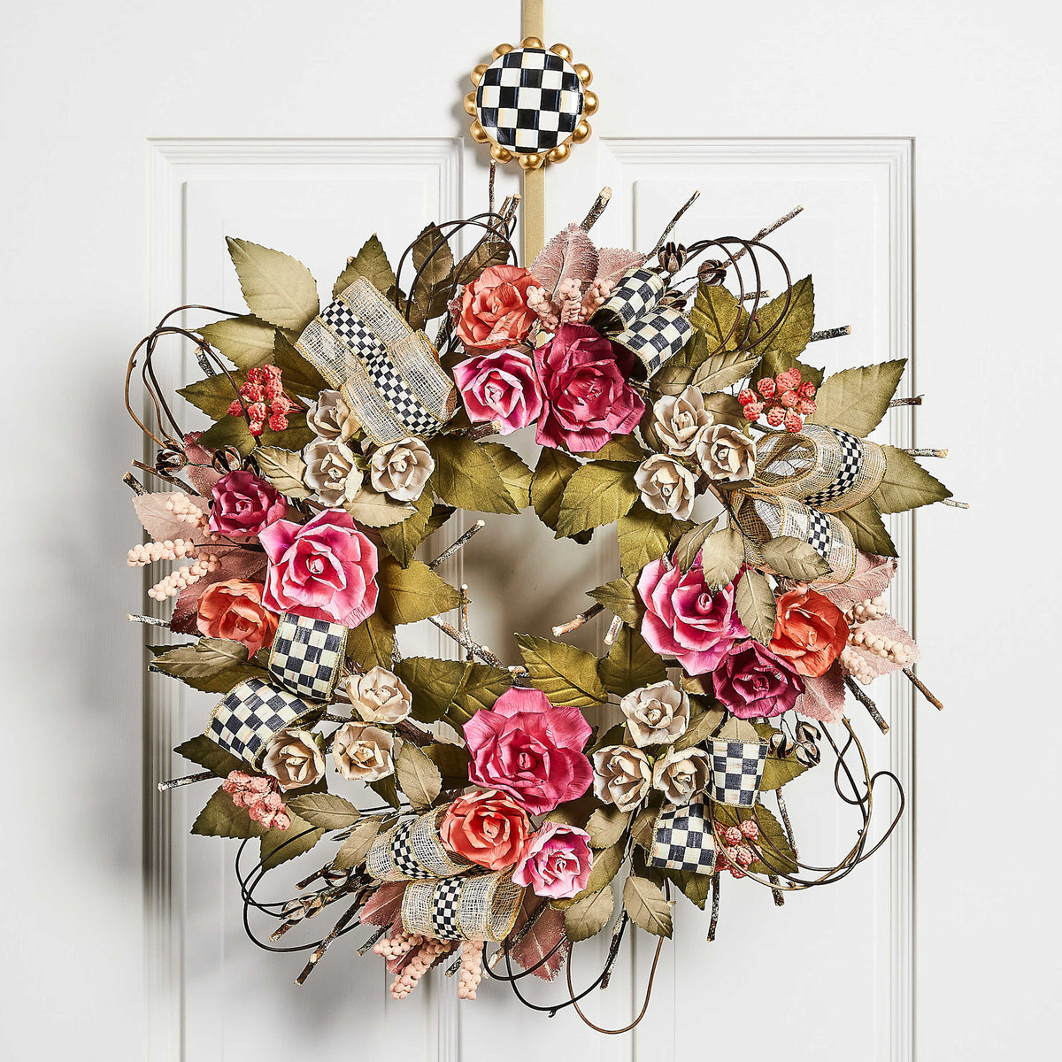 Polyresin courtly check wreath hanger with a black-and-white checkerboard pattern and curved silhouette.