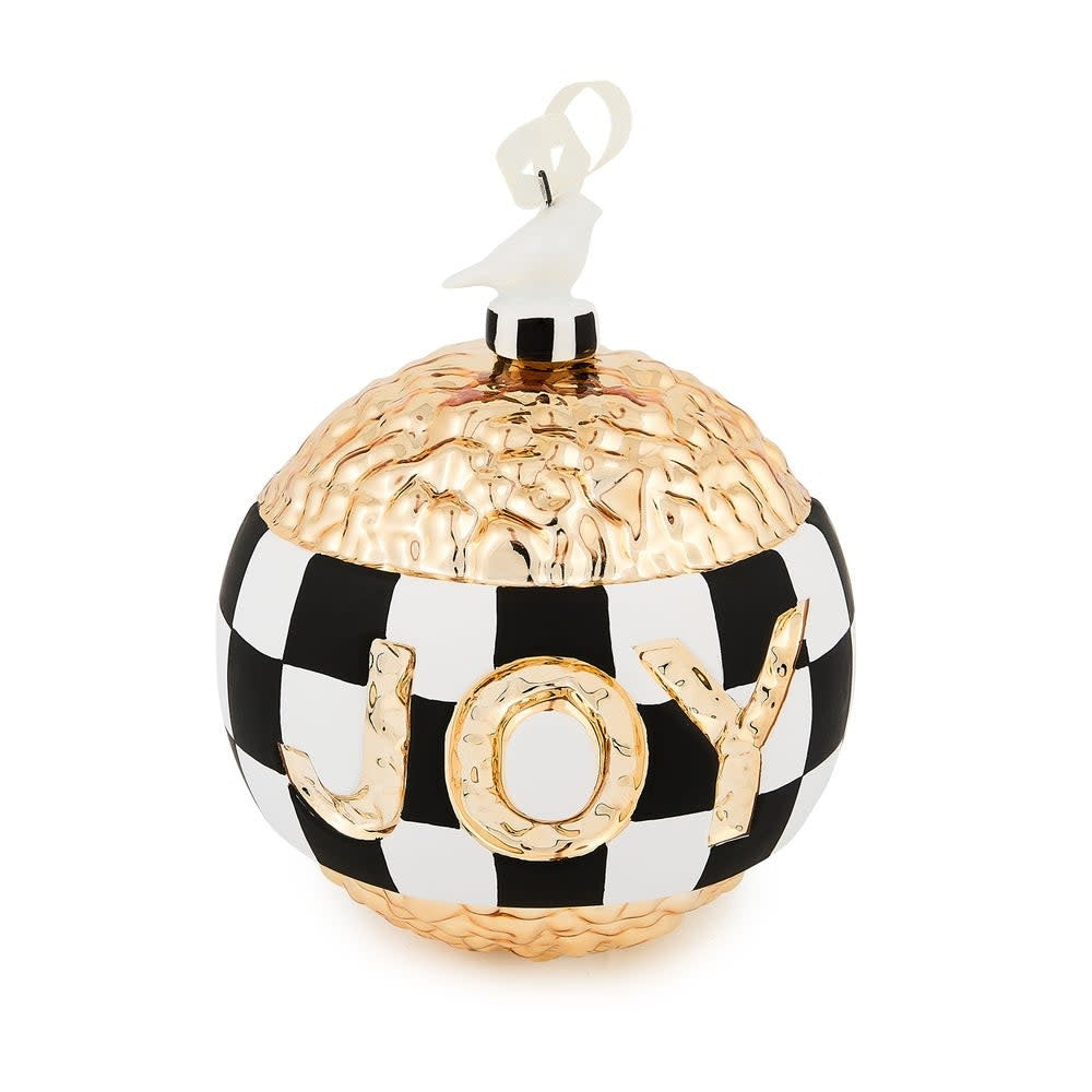 Glass Christmas ornament with a gold 'JOY' inscription inside.