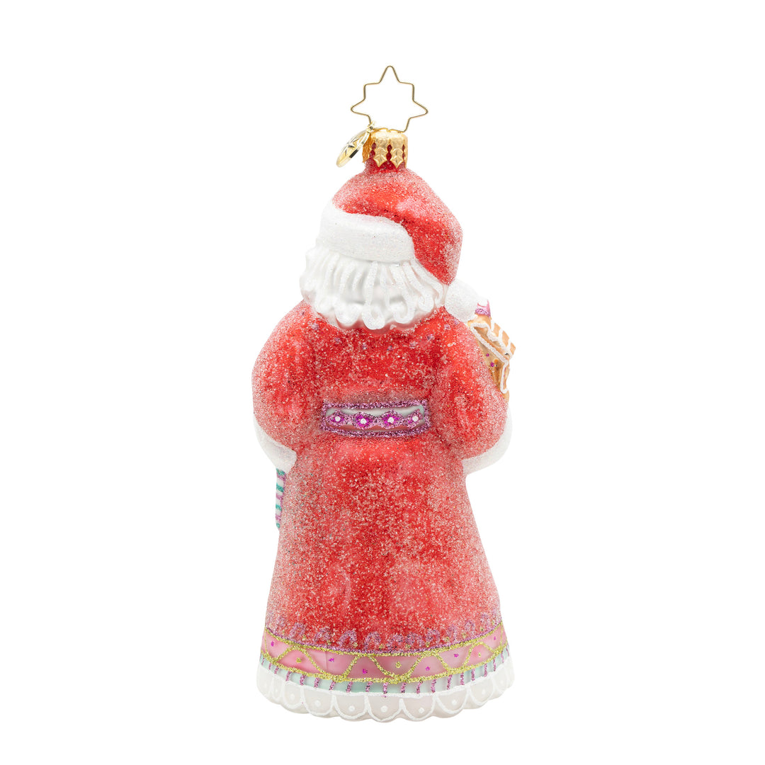Back view of a red glittery Santa Claus ornament with a white beard and decorative pink trim.