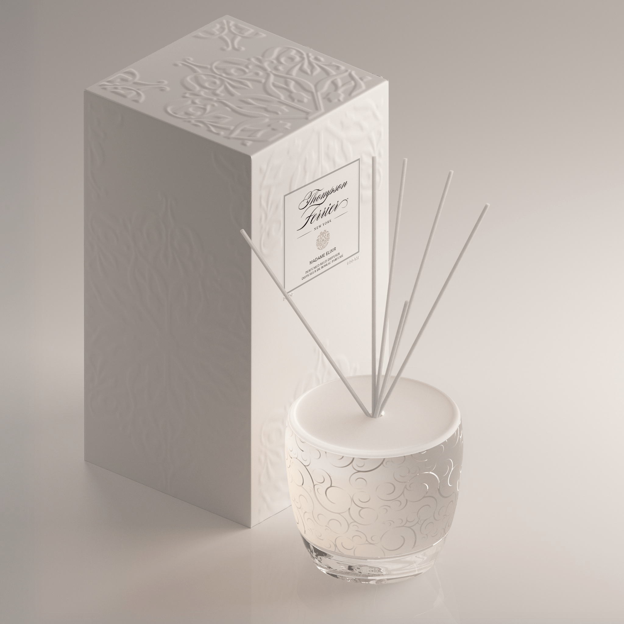 Madame Elixir reed diffuser bottle with clear glass body holding amber liquid and black reeds.