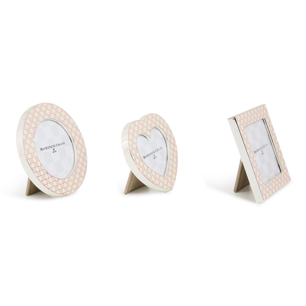 Set of three silver-plated frames in heart, circle, and square shapes with pink and white checks.