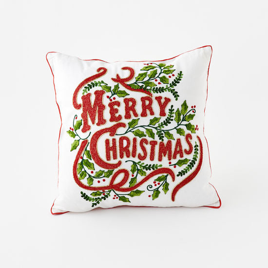 Square 18x18 Christmas pillow with red fabric featuring white snowflake pattern and green holly accents.