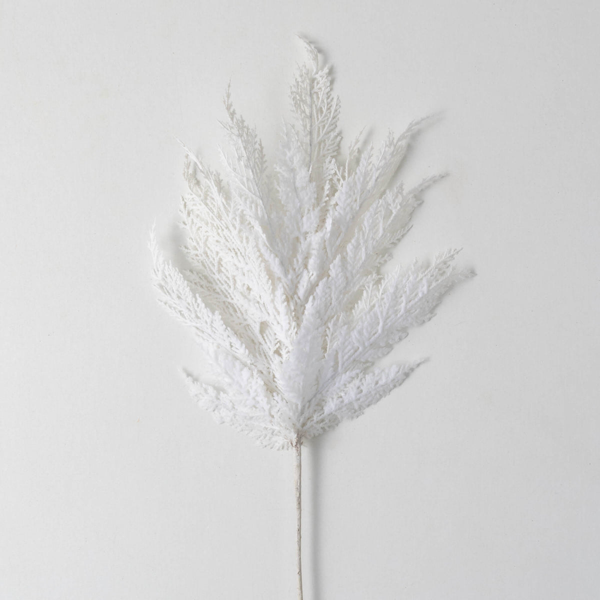 White Cypress Spray artificial foliage stem with textured, snowy white needles on a single stem.