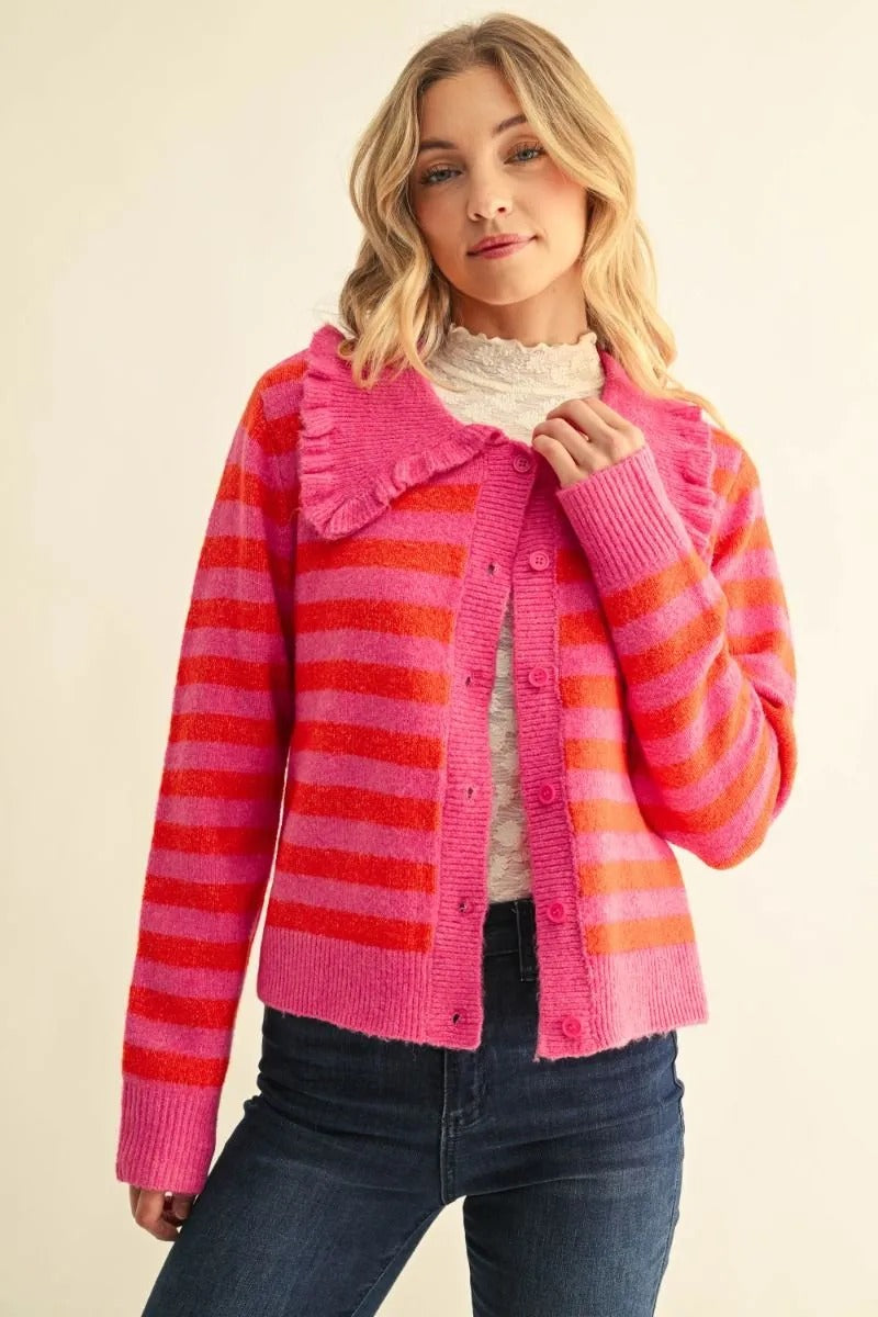 Mika pink and orange striped button-down cardigan with a ruffled collar and long sleeves.