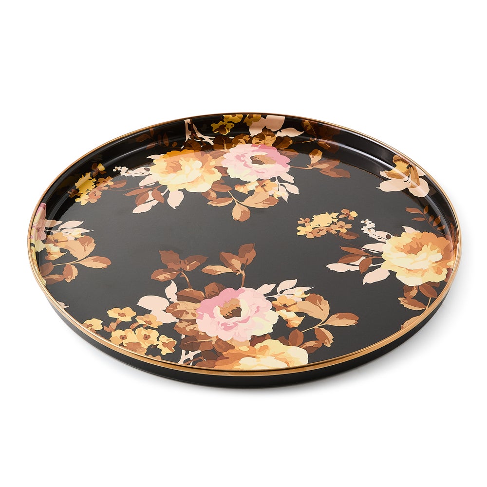 Round brown tray with hand-glazed steel surface, bronzed stainless rim, and floral transfer decoration.