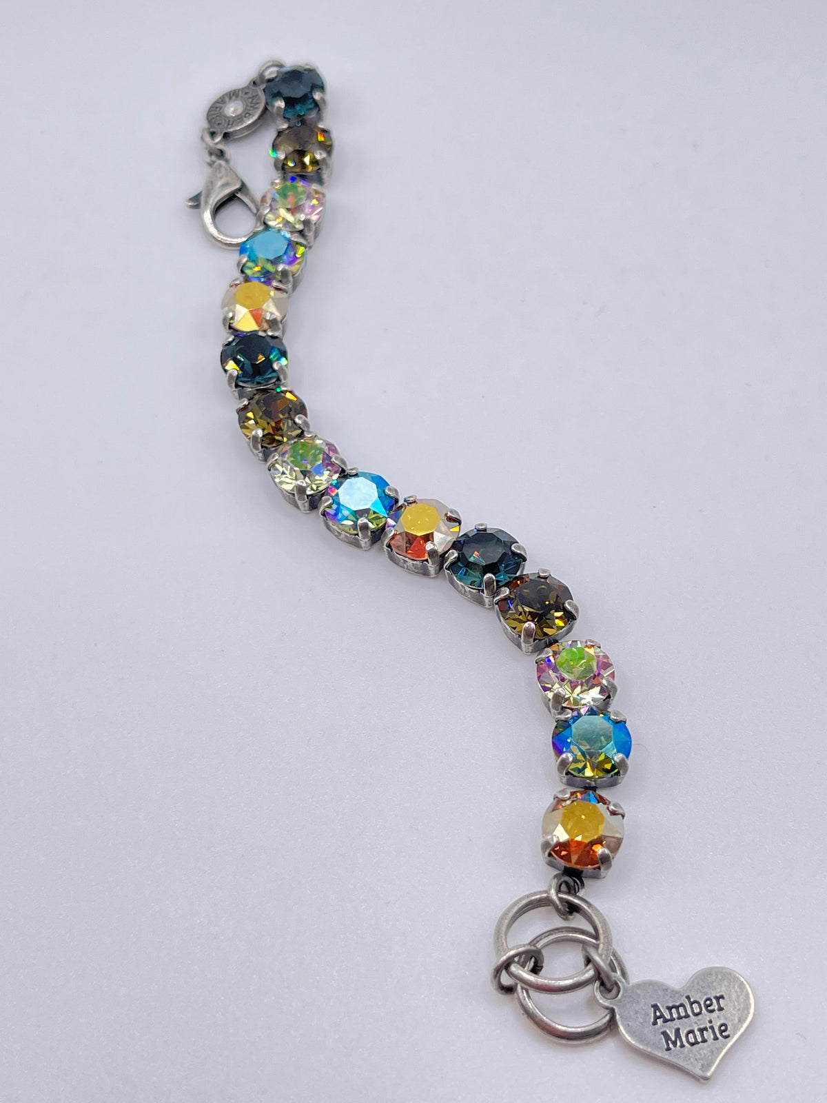 Classic Bracelet in dark blue, brown, and gold tones with a textured pattern.