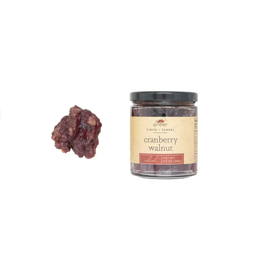 Jar of cranberry walnut relish with orange zest garnish