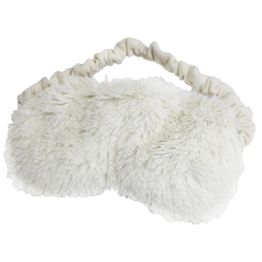 Cream-colored Warmies eye mask with soft fabric texture.